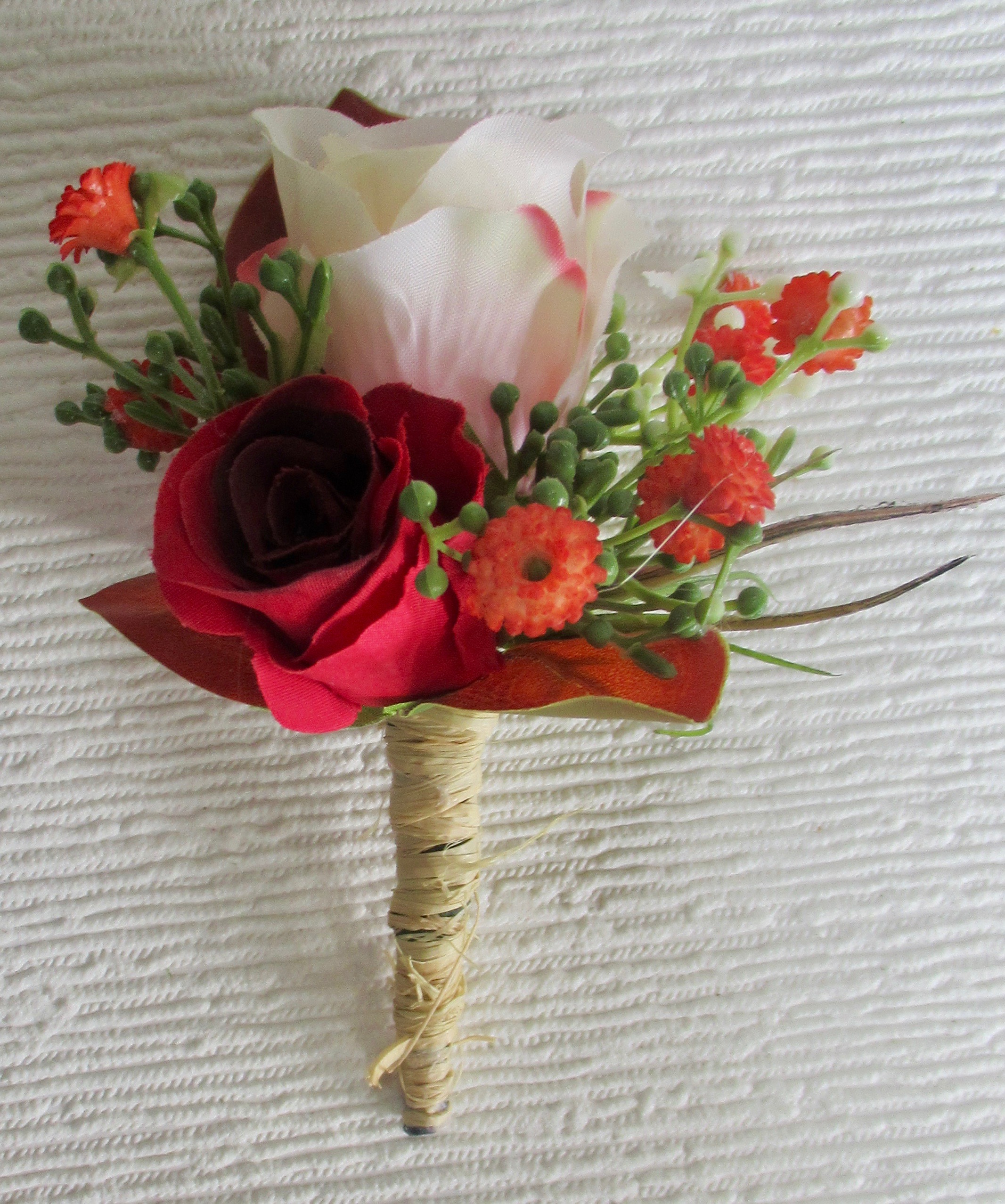 Blush, red and orange buttonhole